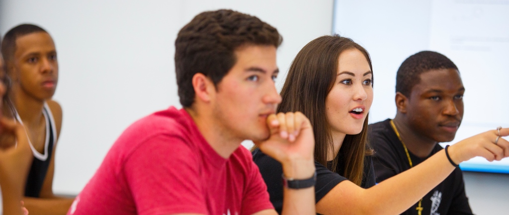 Three students participate in a classroom discussion at Loyola Marymount University.
